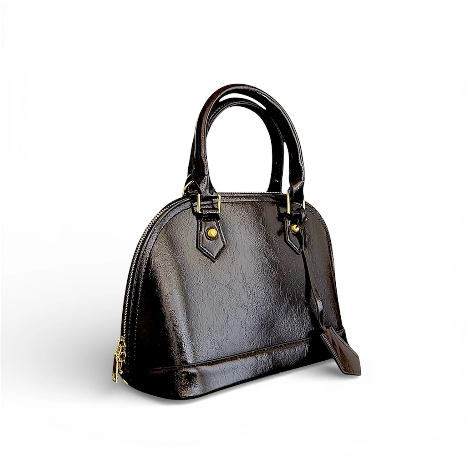 Cartera elegante de mano en material ecocuero con detalle colgante